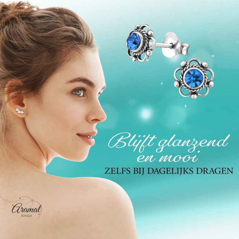 Zilveren Bloemoorbellen Blauw 7 mm -
