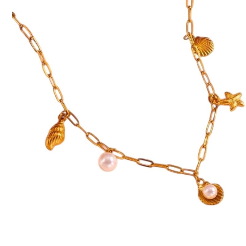 Goudkleurige damesketting met schelp- en parelbedels - Dames