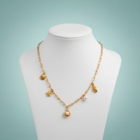 Goudkleurige damesketting met schelp- en parelbedels - Dames