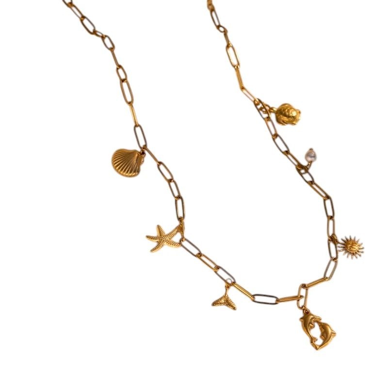 Goudkleurige ketting met parel & dolfijn bedels - 40cm - Dames