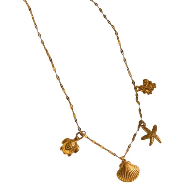 Goudkleurige ketting met schelpen & zeethema-bedels - Dames