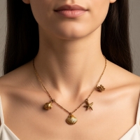 Goudkleurige ketting met schelpen & zeethema-bedels - Dames