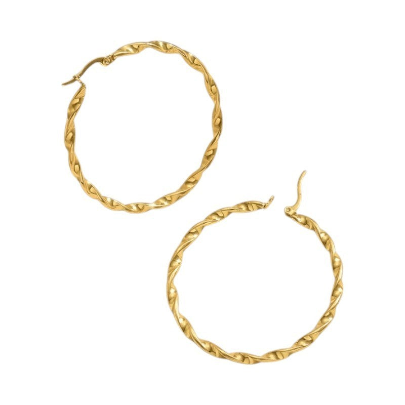 Goudkleurige twisted oorringen 30mm -