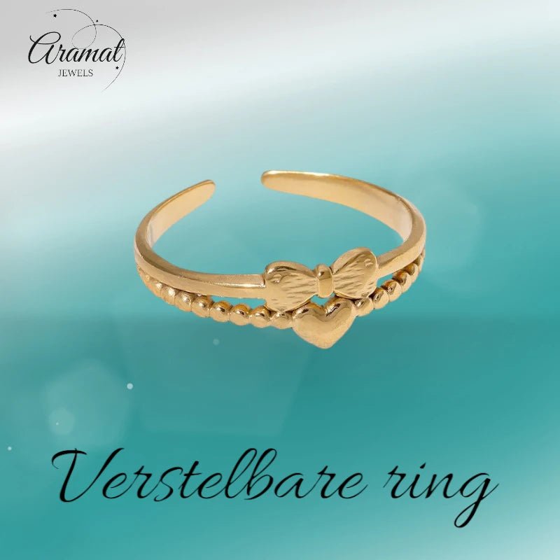Stalen Damesring - Strikje & Hartje - 7mm - Goudkleur -