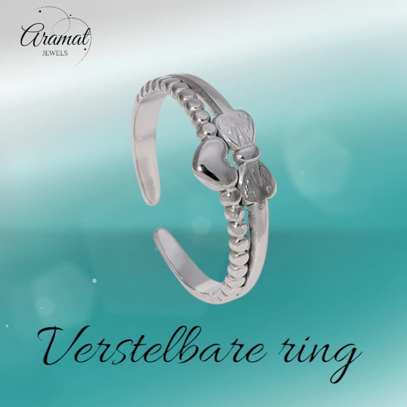 Stalen Damesring - Strikje & Hartje - 7mm - Goudkleur -