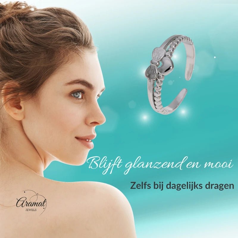 Stalen Damesring - Strikje & Hartje - 7mm - Goudkleur -