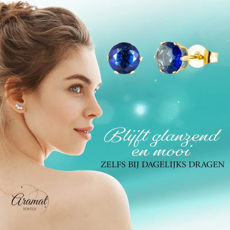 Goudkleurige Oorbellen Met Donkerblauwe Zirkonia -