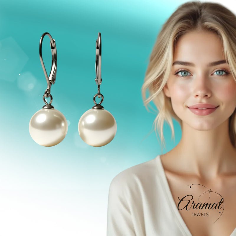 Oorhangers &acirc;&euro;&ldquo; RVS met Ronde Witte Parel (27mm) -