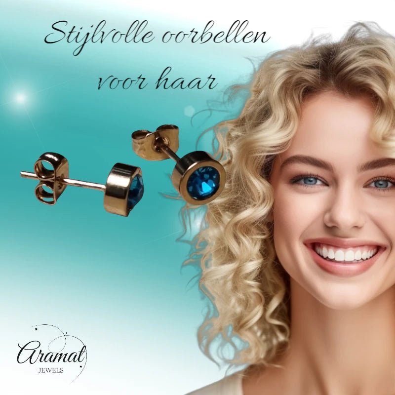 Goudkleurige oorbellen met aqua blauw zirkonia 6mm -