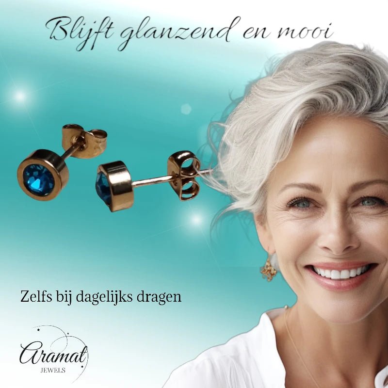 Goudkleurige oorbellen met aqua blauw zirkonia 6mm -