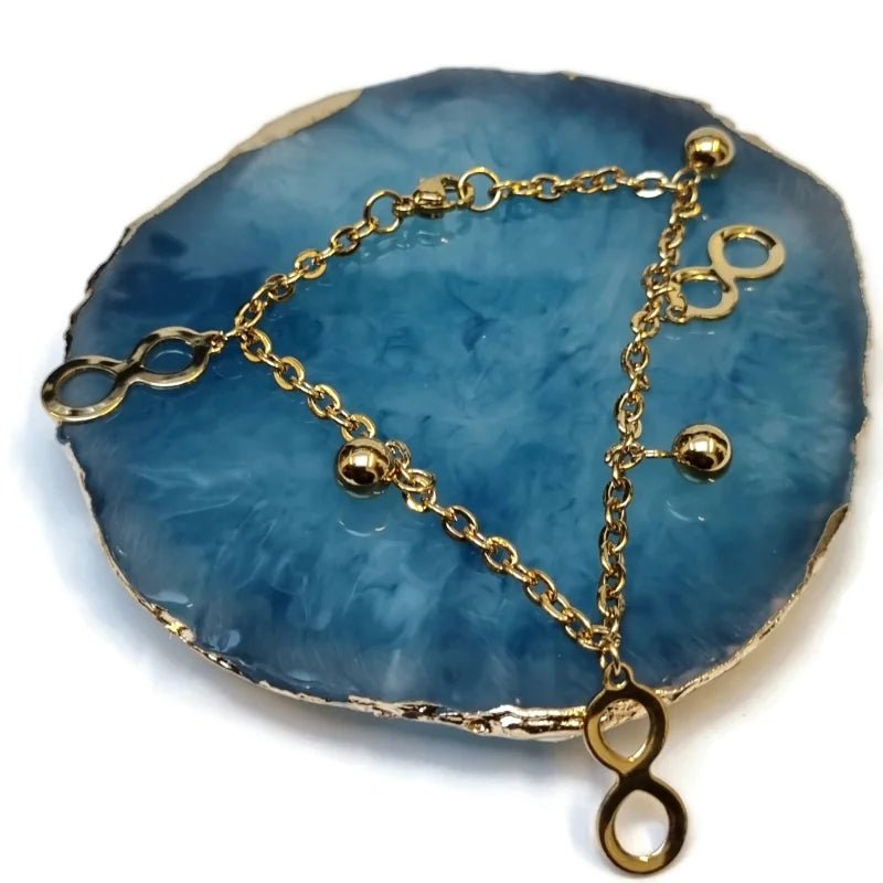 Goudkleurige Bedel Armband met Infinity Symbolen
