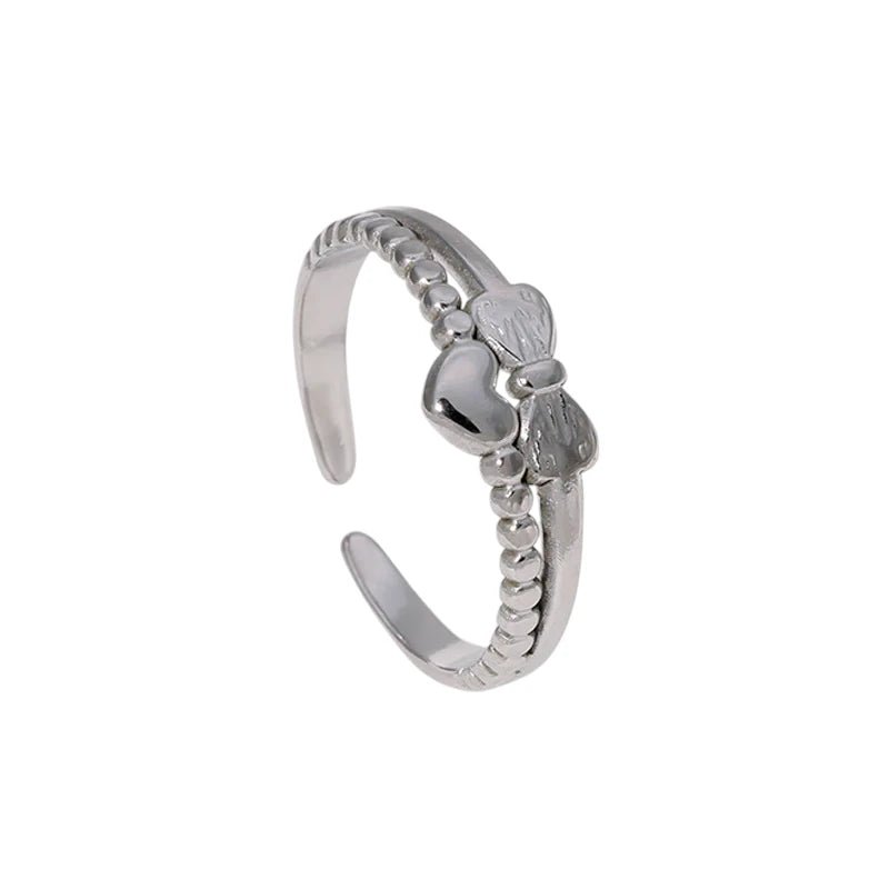 Stalen Damesring - Strikje & Hartje - 7mm - Zilverkleur -