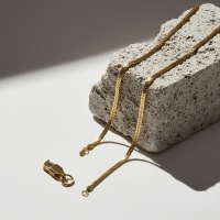 Platte gourmet ketting met bewerkte rand 5mm goudkleurig staal - 55cm - Unisex