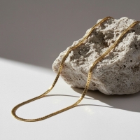 Platte Gourmet Ketting met bewerkte rand 6mm Goudkleurig Staal - 55cm - Unisex
